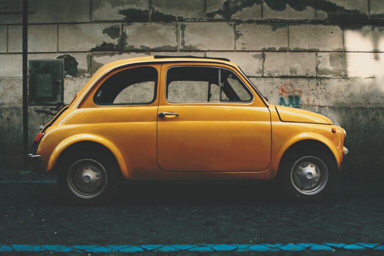 negative-space-classic-fiat-5-yellow-car-ilya-yakover-thumb-1